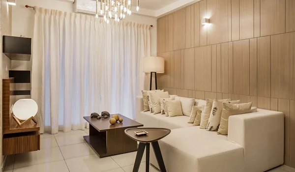 Naturally lit living room interior of a high-rise apartment at Sattva Courtyard Varthur Bengaluru
