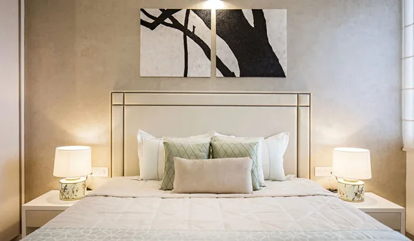Master bedroom interior with wardrobe and balcony access in a Sattva Courtyard apartment